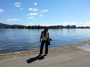 On the banks of Lake Burley Griffin with a science center in the background.