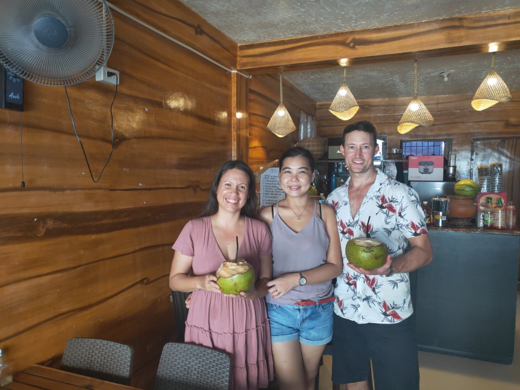 Our first fresh coconuts with Ben and Himaya